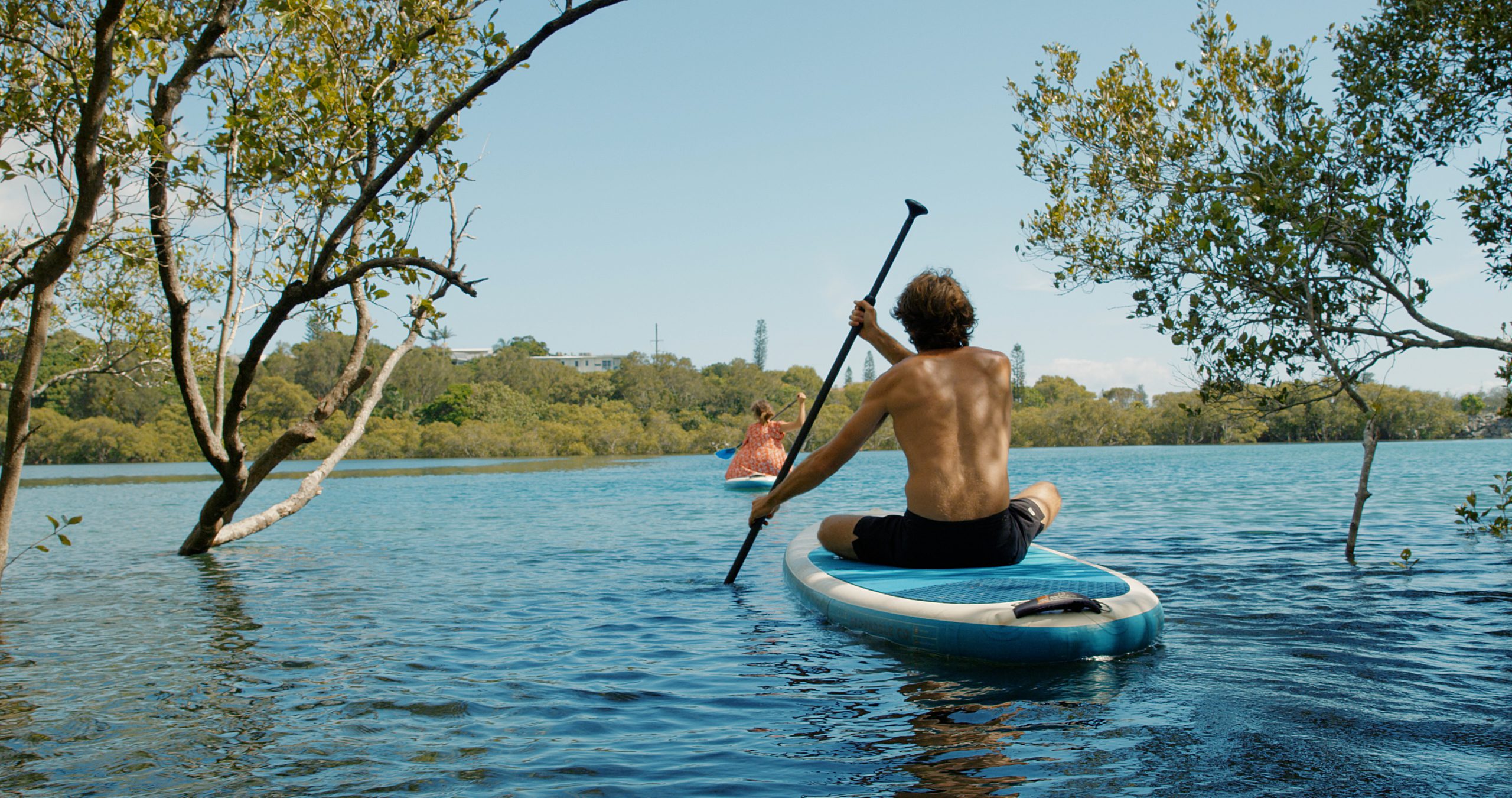 couple paddleboarding on cudgen creek