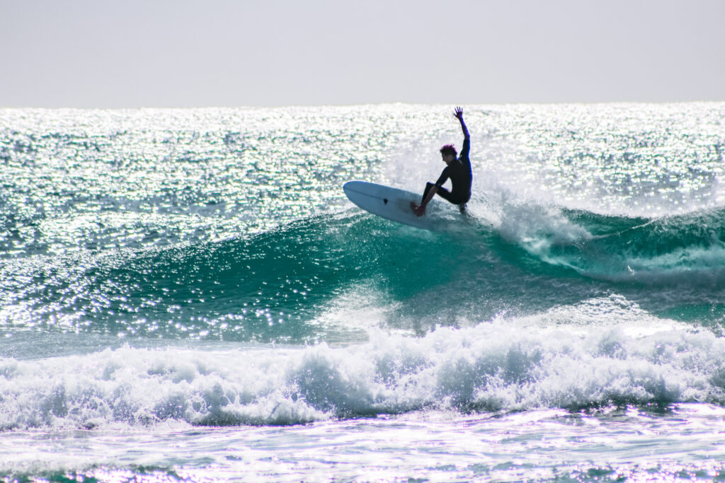 surfing at kingscliff beach