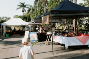 Child walking around Duranbah Road Farmers Market