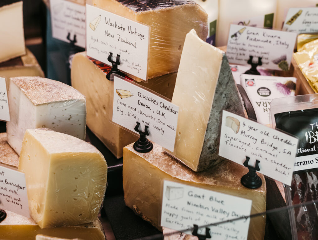 Close up of cheeses in a cabinet