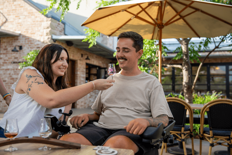 image of couple with accessibility needs at husk farm distillery 